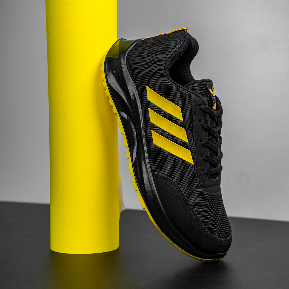 کفش ورزشی آدیداس مشکی زرد مردانه مدل Silva